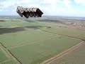 flights in south louisiana.  landing a helicopter at the airport and taxying to a parked position.