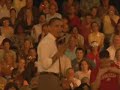 Barack Obama fist bumps audience member