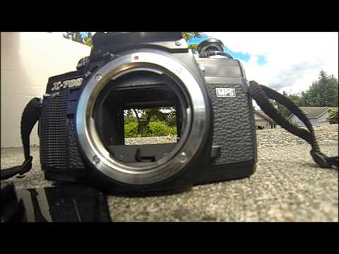 how to open a minolta x 700 camera