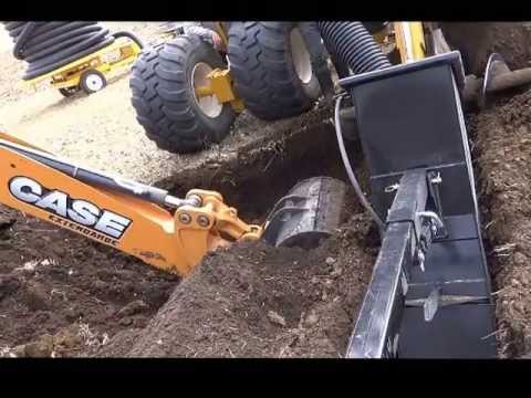 Case590 - CASE 590 SN backhoe digging out a rock after DK 628 trencher hit a rock, for a second time. See past three videos for reference - shows trencher modification...