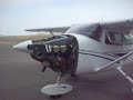 my fellow students and i doing a short ground run-up on an engine we overhauled at school, it sounds weird when i walk behind the prop, but that's just my camera.  upclose this thing sounds really nice i think.