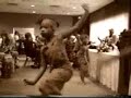 mwalimu leads the marcus garvey academy beginners drum and dance trop performed for mrs. willie k woods, area f schools and guests at the golightly career and technical center, thursday october 22, 1998