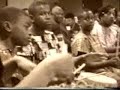 mwalimu leads the marcus garvey academy beginners drum and dance trop performed for mrs. willie k woods, area f schools and guests at the golightly career and technical center, thursday october 22, 1998