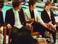 panic! at the disco are being interviewed, mtv's moonman drops by.