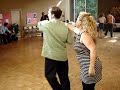 wesley and debbie demonstrate the intermediate west coast swing combination they taught during the workshop for their 5th saturday wcs theme dance, june 30, 2007. the combination consists of a closed rotating basic to open (reverse throw-out), a push break to 2 hands, a head-loop-entry whip with outside double turn exit, push break with lady's push-off hijack, an inside turn left-side-pass with man's turn on 4 with hand change, and a lsp from trailing position.