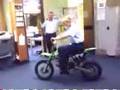 A policewoman on a confiscated motorbike