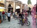 tourists and local palestinian boys on bikes in old city