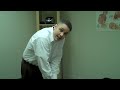 Bellevue Chiropractor Dr. Edward Owens DC shows a typical visit procedure. Demonstration of chiropractic adjustment in Dr. Owen's Bellevue office. Showing how he addresses a patient with mid-back pain. Patient with motorcycle accident trauma.