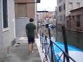 Splashy splashy in Venice, friend pushes friend