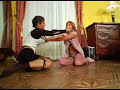 Two sassy chicks duke it out teaing each others' clothes in the process.