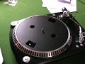 BELT DRIVE TURNTABLE NEXT TO A DIRECT DRIVE.