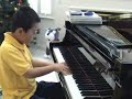 Lawrence, 8 years old, play Mozart Sonata K330 1st mov\