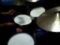 Noel Okimoto playing an improvised drum solo with brushes. Toms and snare are fitted with calf heads.