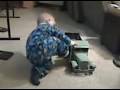 This is a video of our grandson TJ.  He had been riding motorized toys since he was 13 months old.  He is playing with his great grandfather's toy truck and he cannot understand why he cannot get in and drive since the door opens and the steering wheel works.