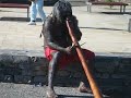 Didgeridoo player demonstrates two different styles