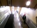 Joe slides down Escalator in central station