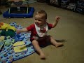 Baby laughing at dog