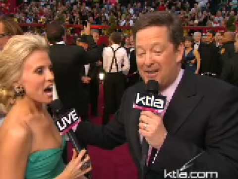 Mickey Rourke checks out Jessica Holmes on the red carpet