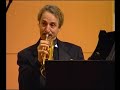 Allen Vizzutti is playing on the piano and the trumpet
