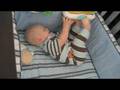 Playing in the crib