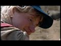 A group of tourists are taken a little too close for comfort to a black rhino and its baby. Would you be brave enough to get this close on foot? Watch this exciting stop on African safari.