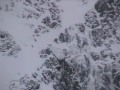snowboarding a steep couloir in Whistler Blackcomb
