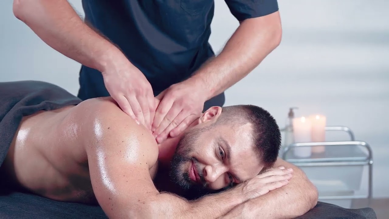 Sports massage man has deep tissue massage