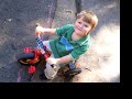 Noah races on his tricycle
