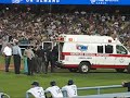 Umpire Is Taken Off By Ambulance