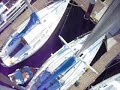 Up mast on Cal 29 sailboat at the dock