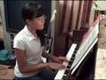 Chrisha playing piano