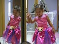 clara dressed as a butterfly and loving kitty