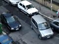 women tries to park in a realy small parking spot very funny