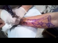 Man Screams in Pain Getting Tattoo