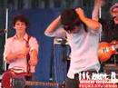 Joe Jonas Putting His Tie on His Head