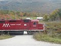 vermont railway train bnr extra, the daily train from rutland to north bennington, makes some good noise as it comes to a country road crossing just south of danby station, in danby, vermont.  today's consist is gp40 301 with a 13 car mixed freight.  enjoy the sound of the nathan p5 horn on the 301.  if you have any questions about the video, feel free to message me.  comments are welcome.  the video was taken on october 6th, 2008.