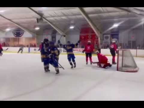 Point shot tipped into top corner