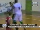 Basketball-Player punches hard the refferee