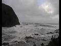 Surf crashing on rocks.