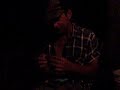 TC rolls a cigarette