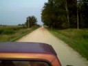 Riding in the back of a truck in the Iowa countryside