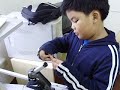 Benito checks out a microscope