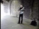 This is a nylon string travel guitar with a pickup.