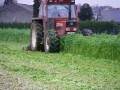 videos de tractorfoto.tk-New Holland 110-90 maait gele mosterd in Borgloon