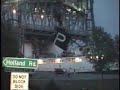 A ship gets smashed up going under a bridge.