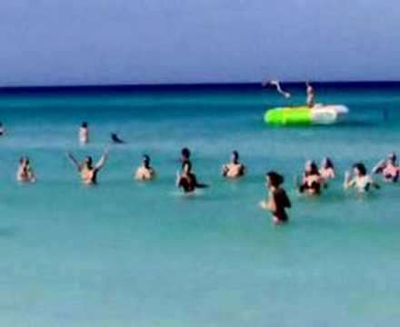 Sexy girls dance in the Caribbean sea