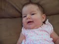 Cute 3 month old baby girl smiling and blowing bubbles - Londyn