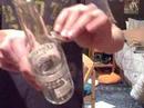 Coin through bottle