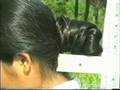 Hong has her enormous bun measured
