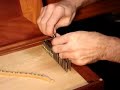 more harpsichord stuff @ www.hpschd.nu
carey beebe demonstrating string winding on an historic tuning pin.
the wire must be firmly locked on the pin to prevent it slipping at pitch.
the string is pulled tight from the hitchpin loop and the relevant tuning pin selected. a loose spiral of wire is wrapped down the pin. this must be crossed over, and a close winding commenced to run down the pin, wrapping tightly on top of the loose spiral. the tension from the hitchpin must be maintained, or the wire will slip off. the impression of the loose spiral will be visible through the kinks in the close winding which locks the wire on the pin. it is essential that the loose end is removed, and followed by several plain turns of wire around the pin. these can angle down steeply to provide later adjustment for downbearing.
winding is continued until the pin is over the hole in the wrestplank. the pin is inserted and the wire directed around the correct bridge pin. finally, the pin is seated with a tap from the tuning hammer, then brought roughly to pitch.
triple-fretted clavichord by carey beebe, sydney 1983